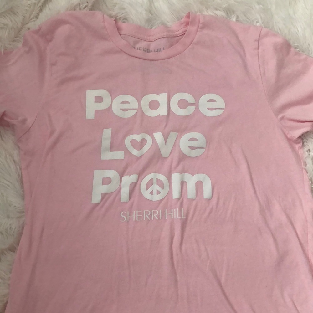 Pink Sherri Hill t-shirt.
